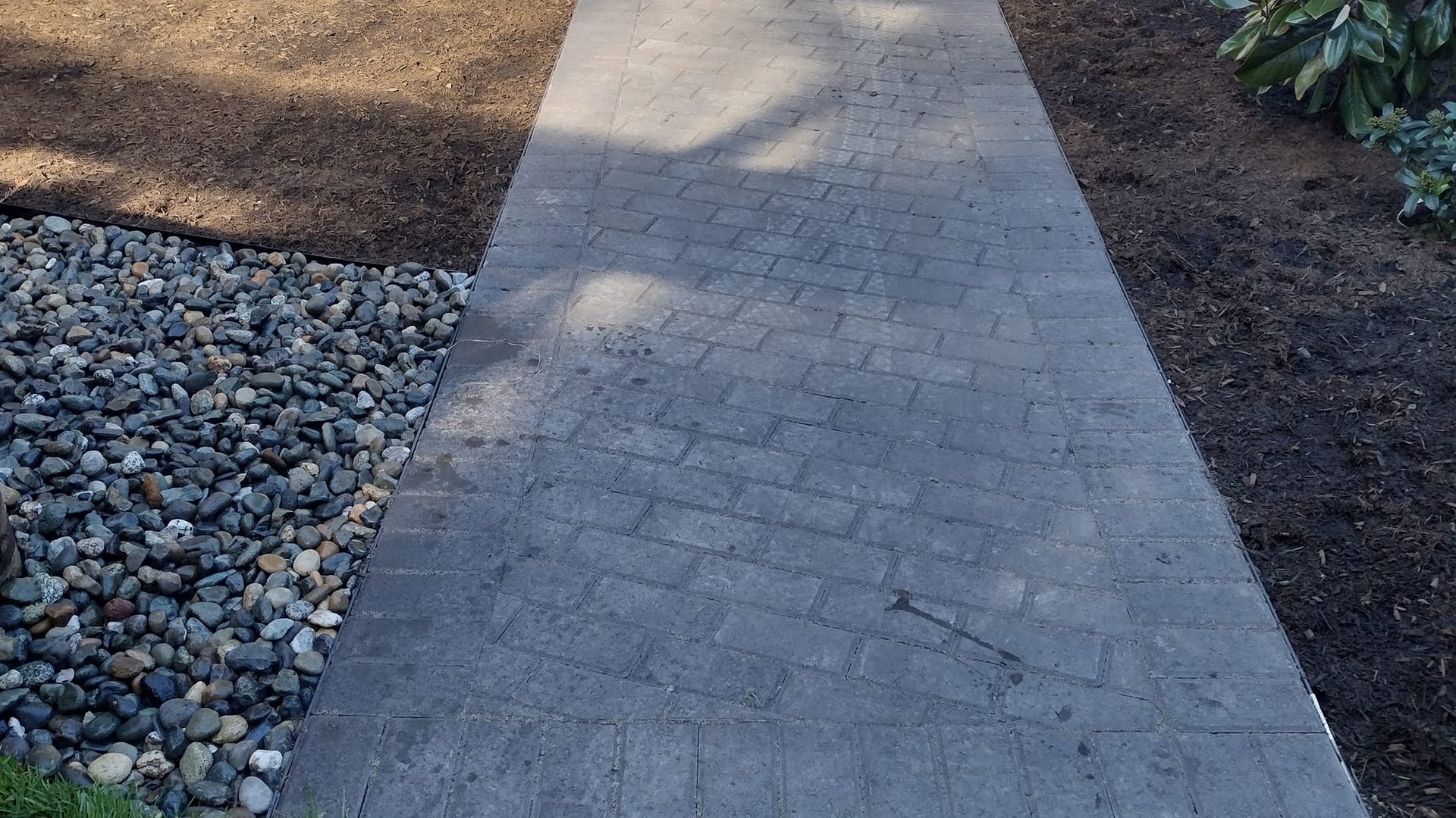 Brick-pattern walkway installed by Superlux Gardening & Landscaping